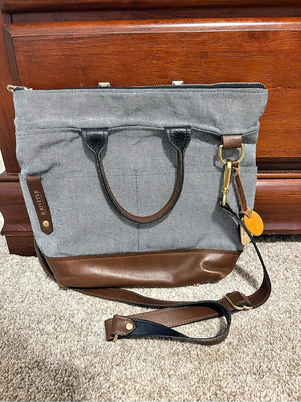 R. Riveter denim (blue/gray) bag with brown leather and gold accents. Excellent
